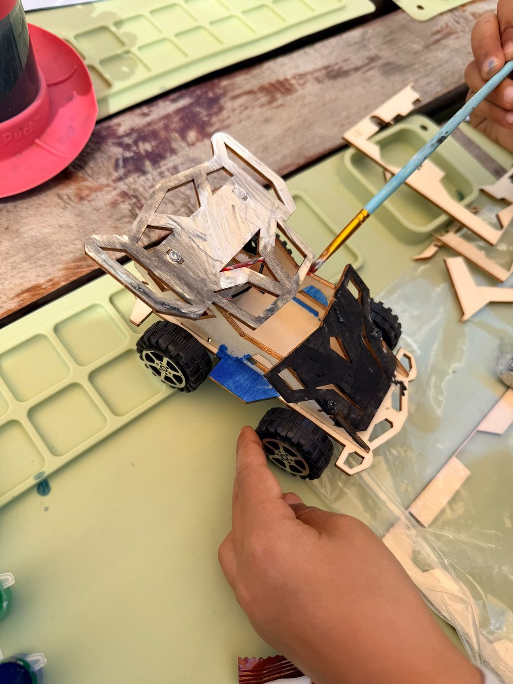 Kids' craft class building a wooden car